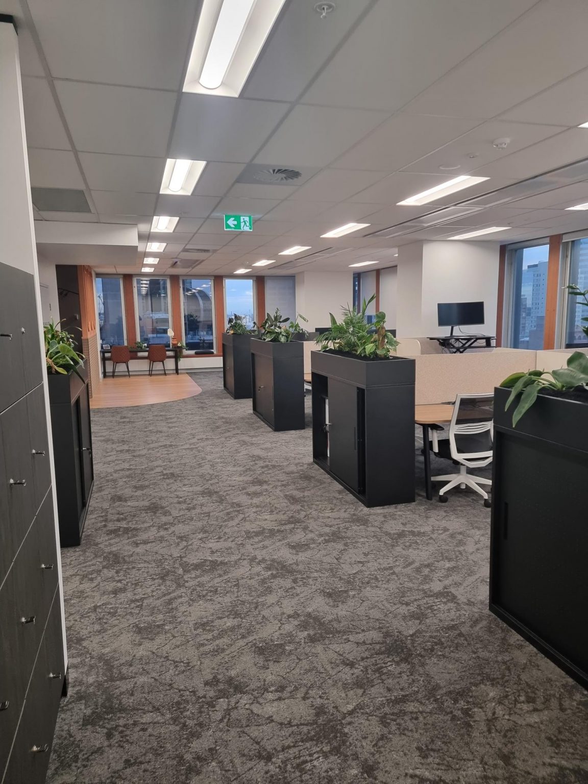 Commercial Electrician Sydney team completed electrical installations in an Amstelveen office featuring modern tables.