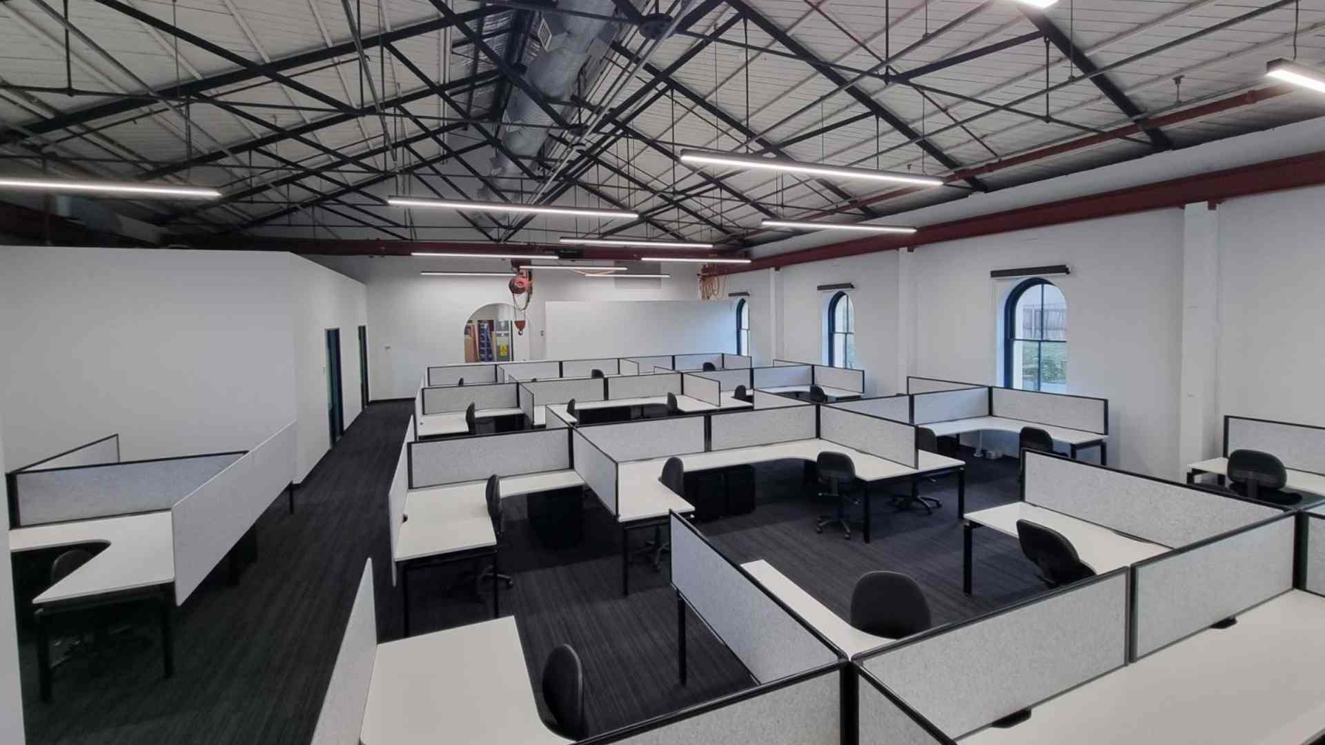 Commercial Electrician Sydney team completed electrical installations in an office room with tables for Defence Australia.