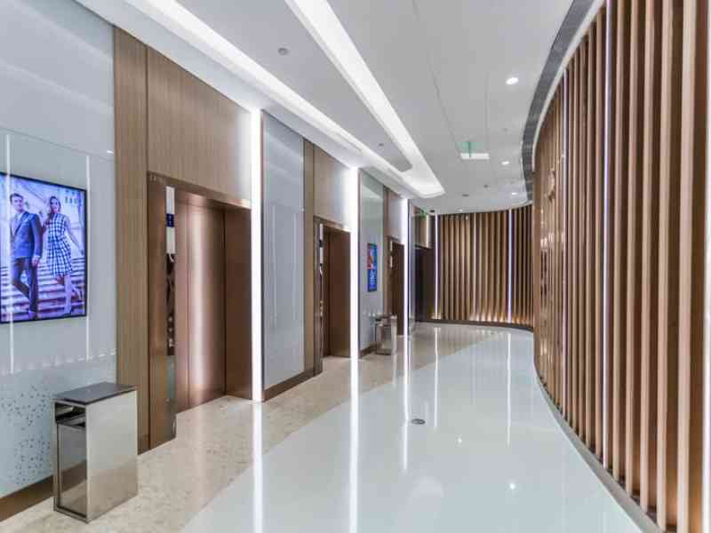 This image showcased a well-maintained elevator lobby with enhanced lighting, serviced by a commercial electrician Sydney.