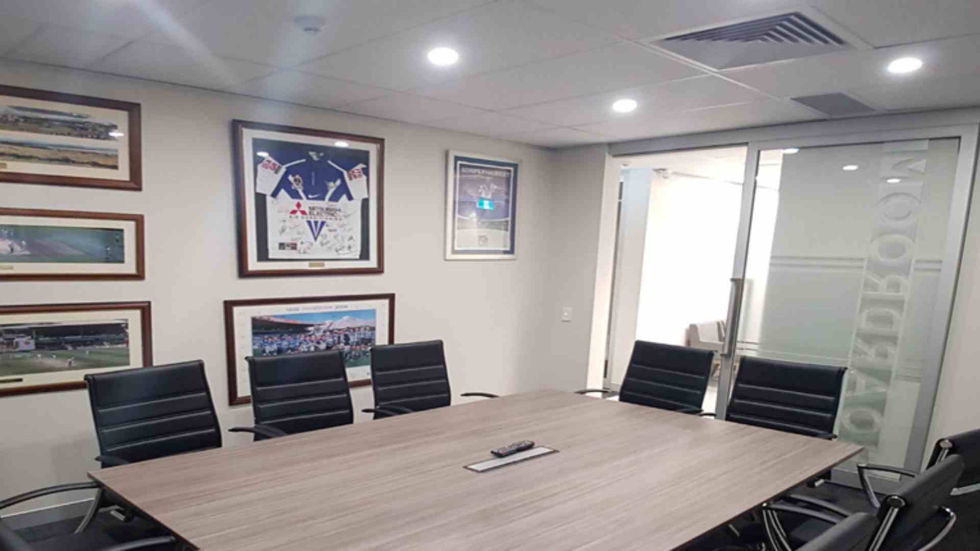 Modern office meeting desk setup after commercial electrician office installation in Sydney.